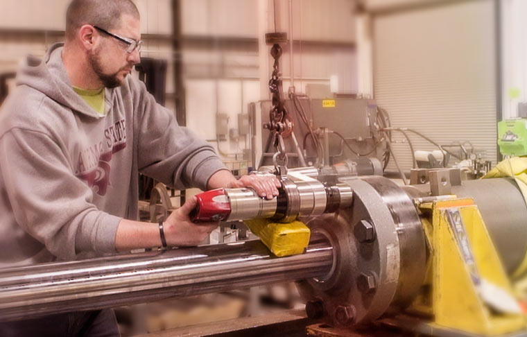 Swanson worker manufacturing a custom cylinder